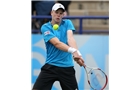 EASTBOURNE, ENGLAND - JUNE 16: Kyle Edmund of Great Britain plays a backhand against Sam Querrey of USA during their Men's Singles first round match on day three of the Aegon International at Devonshire Park on June 16, 2014 in Eastbourne, England.  (Photo by Steve Bardens/Getty Images)